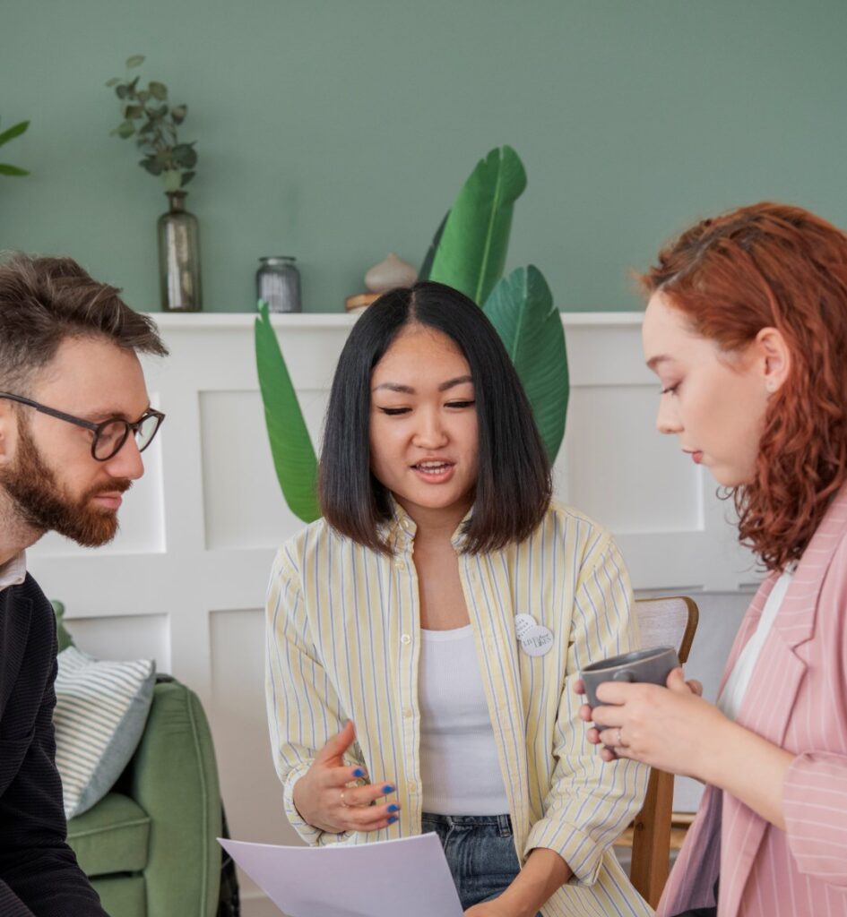people-having-a-debate-while-looking-over-computer